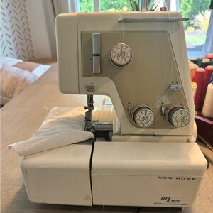 New Home Serger and assorted Cone Threads